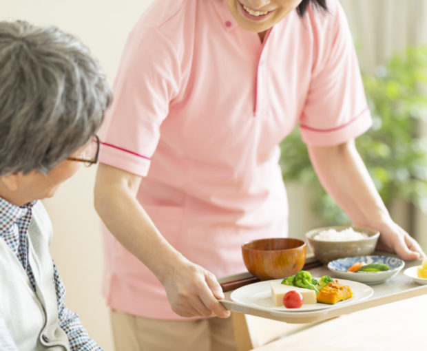 Caregiver preparing a meal